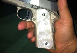 Quality Justin's Colt Defender Pistol with White Pearl Panel Grips